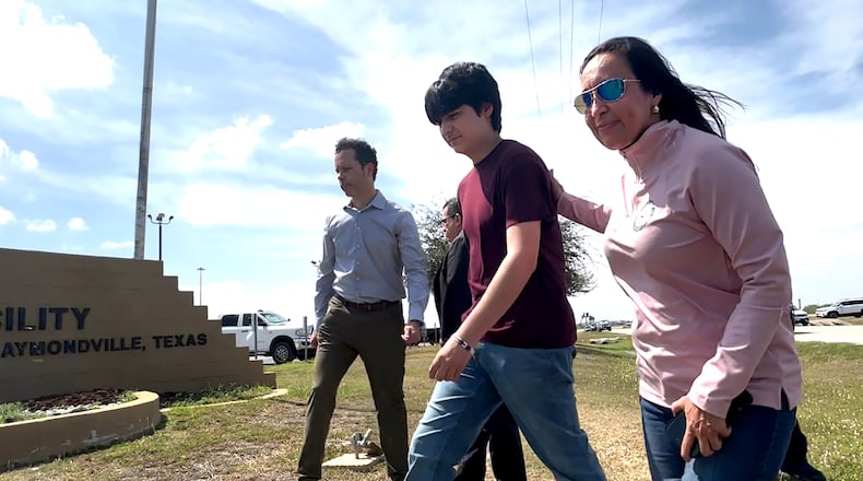 Antonio Gamez CuÈllar, 18, walks out of the El Valle Detention Facility in Raymondville, Texas on Monday, March 9, 2026 escorted by his attorneys, EfrÈn C. Olivares and Carlos M. Garcia, and Republican congresswoman Monica de la Cruz of District 15. (AP Photo/Valerie Gonzalez)