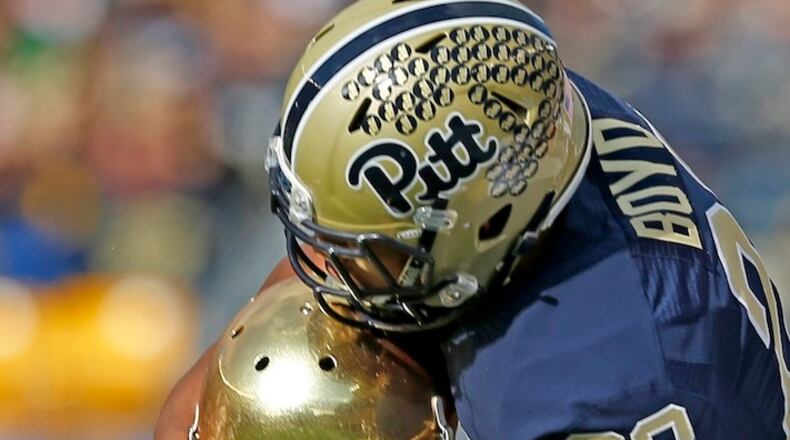 Notre Dame linebacker Josh Barajas (30) breaks up a pass intended for Pittsburgh wide receiver Tyler Boyd (23) in the first quarter of an NCAA football game, Saturday, Nov. 7, 2015, in Pittsburgh. (AP Photo/Keith Srakocic)