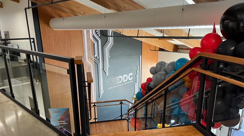 A staircase at Diné Development Corp.'s new offices at 714 E. Monument Ave., in Dayton. THOMAS GNAU/STAFF