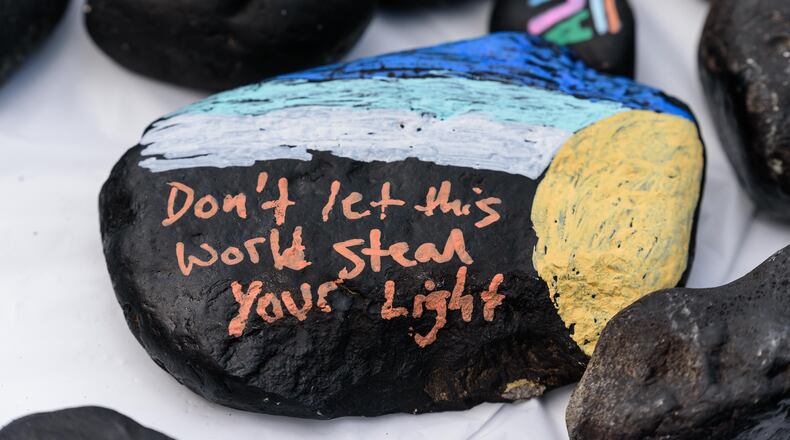 The 4th annual Pride Rocks, a free family friendly LGBTQ+ mental health awareness event returned to Levitt Pavilion in downtown Dayton on Saturday, May 18, 2024. Organized by the National Conference for Community Justice of Greater Dayton, attendees painted small rocks with messages supporting LGBTQ+ pride and suicide prevention. Food trucks, vendors and mental health providers were present to answer questions regarding available mental health resources. Live music was provided by local LGBTQ+ artists Never Try (featured in this gallery) and MelinaMarie. TOM GILLIAM / CONTRIBUTING PHOTOGRAPHER
