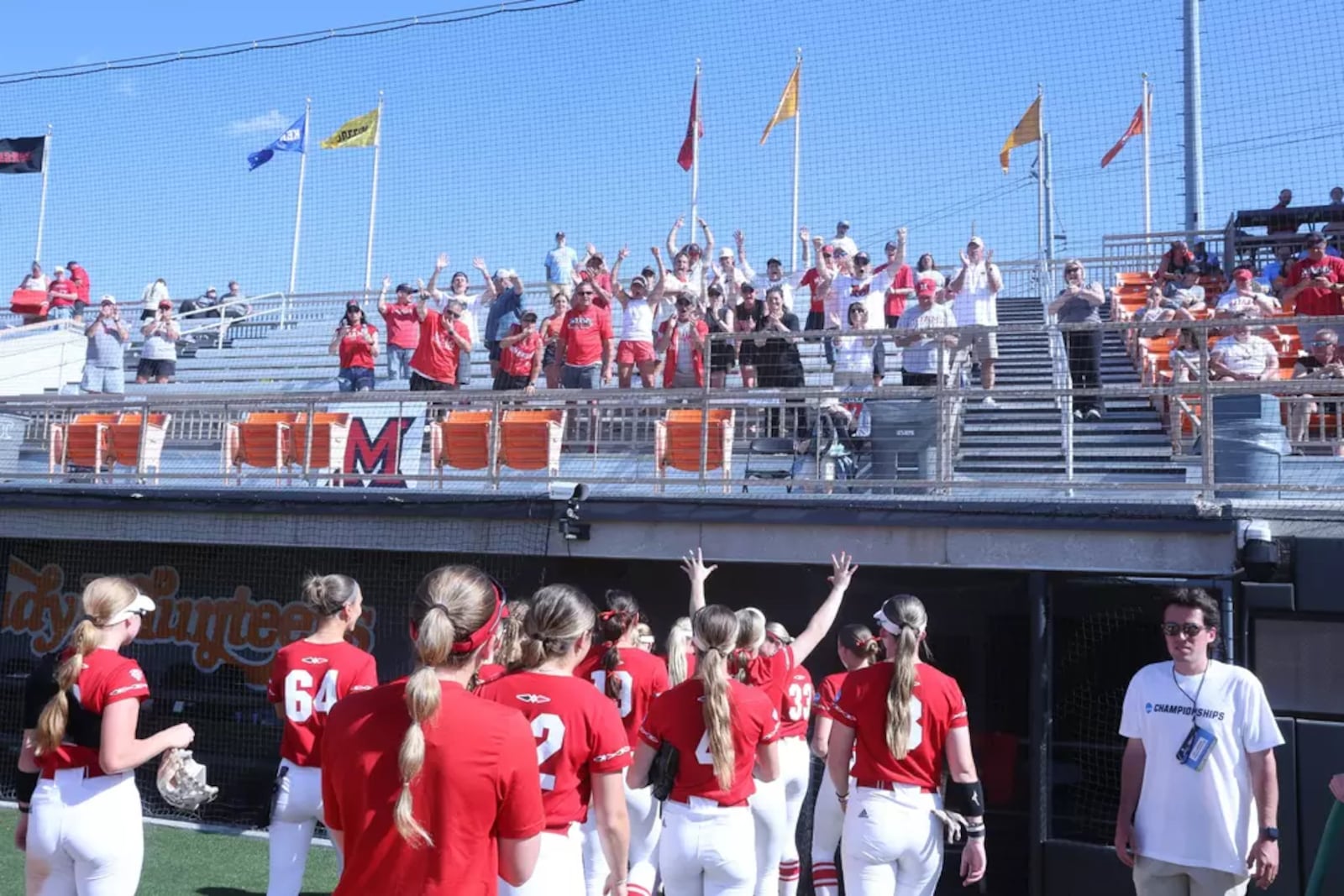 The Miami University softball team is showered with cheers from RedHawks fans on Saturday in Knoxville.