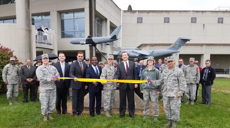 Members of the Tanker and Mobility Directorates held a joint ribbon cutting ceremony Oct. 24 to unveil a model KC-46 simulating the refueling of a C-17 model. The model aircraft was donated by Boeing Co. (U.S. Air Force photo/Brian Brackens)