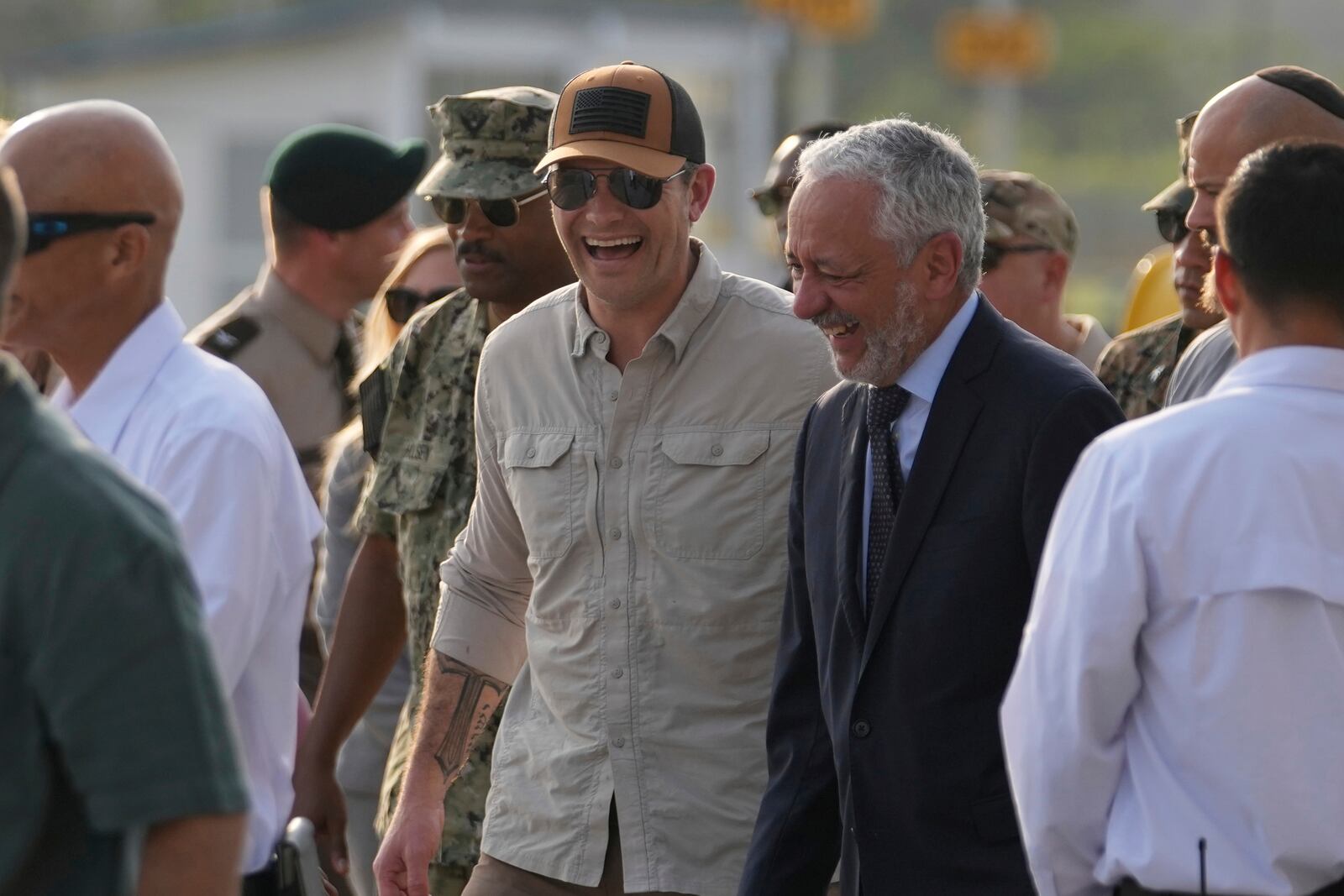 U.S. Defense Secretary Pete Hegseth, center, walks with Panama Canal Authority Administrator Ricaurte Vasquez during a tour of the Panama Canal's Miraflores Locks in Panama City, Tuesday, April 8, 2025. (AP Photo/Matias Delacroix)