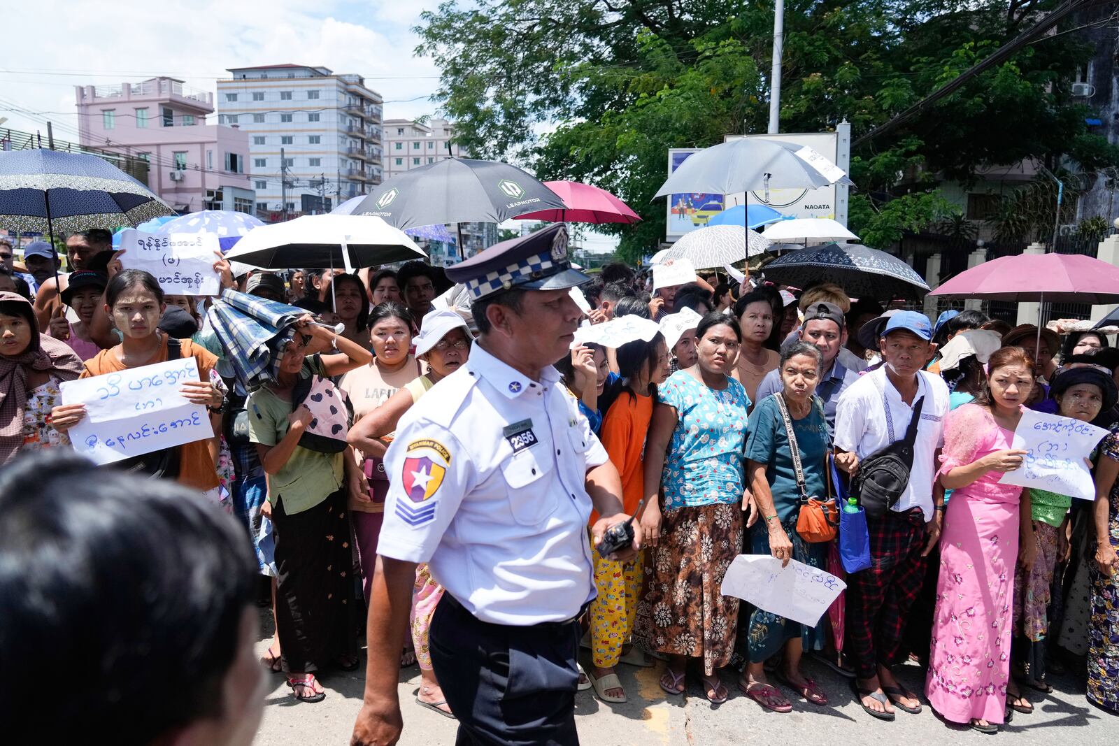 Family members and colleagues wait to welcome released prisoners outside the main gate of Insein prison as the head of Myanmar’s military government granted amnesty to thousands of prisoners to mark the country's traditional New Year Thursday, April 17, 2025, in Yangon, Myanmar. (AP Photo/Thein Zaw)