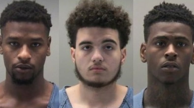 Daylequan Arnold Sr., 22, left, Malik Ogletree, 19, center and King Alli Turner, 21, right