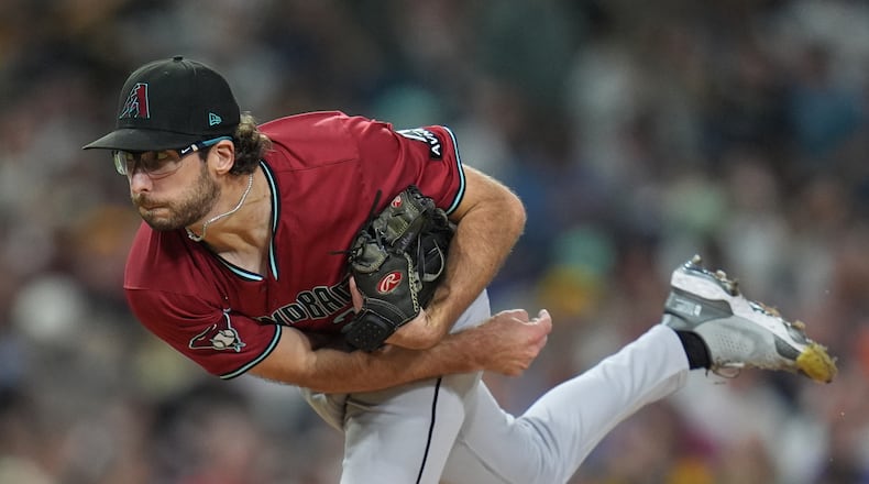 FILE - Arizona Diamondbacks starting pitcher Zac Gallen works against a San Diego Padres batter during the third inning of a baseball game Friday, Sept. 26, 2025, in San Diego. (AP Photo/Gregory Bull,File)