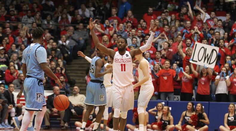 Dayton’s Scoochie Smith tries to pump up the crowd in the second half during a game against Rhode Island on Friday, Jan. 6, 2017, at UD Arena. David Jablonski/Staff