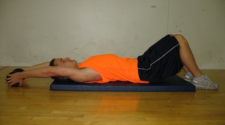 Step 2: Slowly lower the arms overhead until a gentle stretch is felt. Contributed