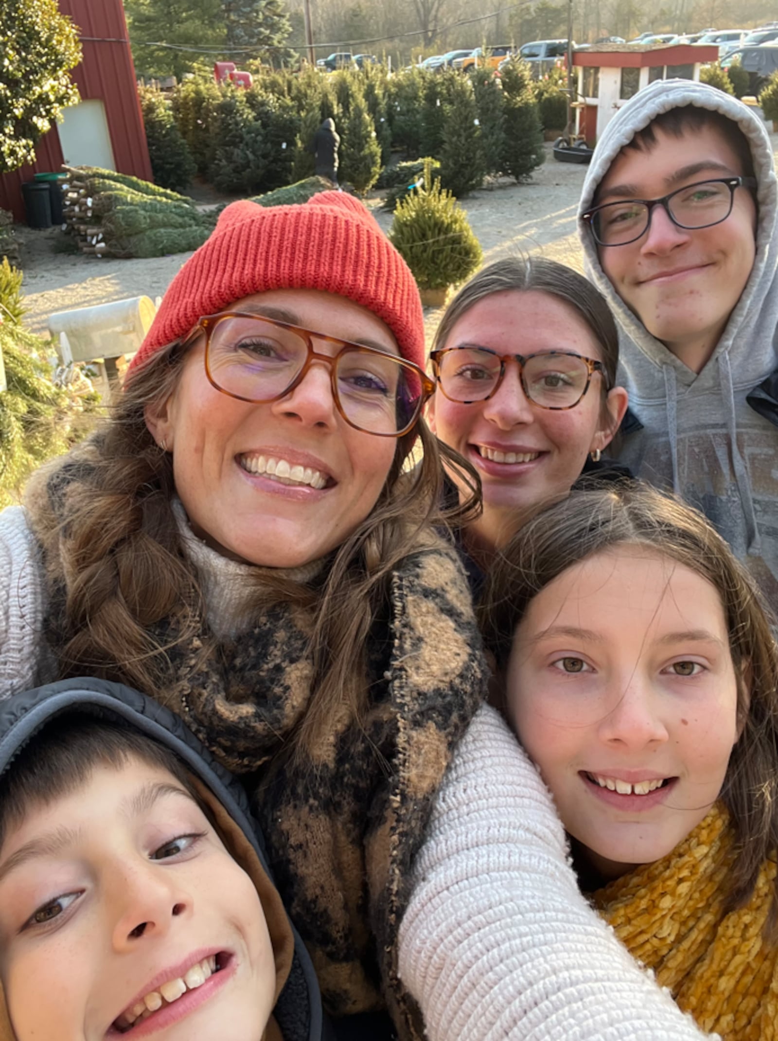 Whitney Kling, a 2001 Oakwood High School graduate and former owner of Top Knot Kitchen, has combined her love for cooking and writing by publishing a weekly “But First, Food” column that appears in the Dayton Daily News. Pictured is Kling with her four children: Crosby and Blake (left to right in the front row) and Reed and Beckett (left to right in the back row) (CONTRIBUTED PHOTO).