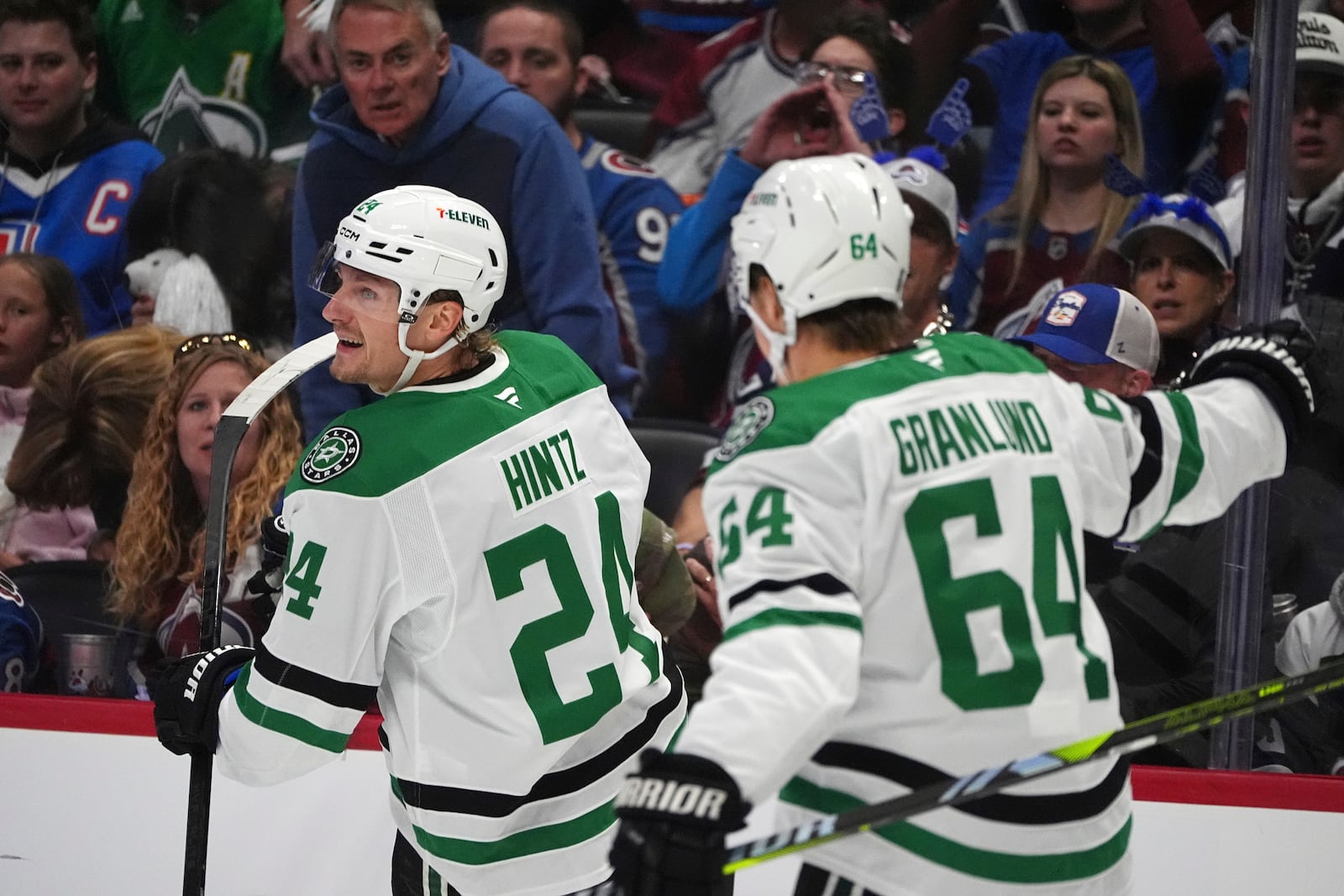 Dallas Stars center Roope Hintz, left, celebrates after scoring with center Mikael Granlund in the second period of Game 6 of an NHL hockey first-round playoff series against the Colorado Avalanche, Thursday, May 1, 2025, in Denver. (AP Photo/David Zalubowski)