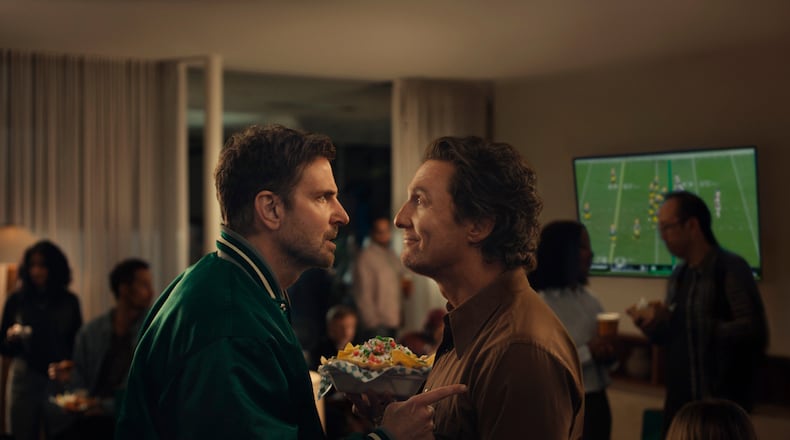 This undated image provided by Uber Eats shows Bradley Cooper, left, and Matthew McConaughey in a scene from the Uber Eats 2026 Super Bowl NFL football spot. (Uber Eats via AP)