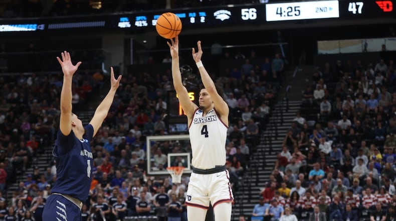 Dayton's Koby Brea makes a 3-pointer during a 17-0 run in the second half against Nevada in the first round of the NCAA tournament on Thursday, March 21, 2024, at the Delta Center in Salt Lake City, Utah. David Jablonski/Staff