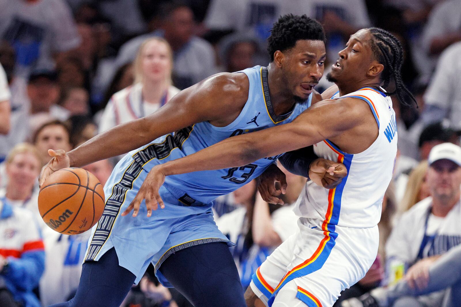 Memphis Grizzlies forward Jaren Jackson Jr., left, drives against Oklahoma City Thunder forward Jalen Williams, right, during the first half in Game 1 of an NBA first-round playoff series, Sunday, April 20, 2025, in Oklahoma City. (AP Photo/Nate Billings)