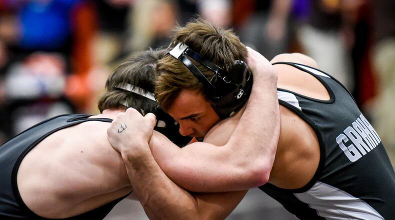 Graham’s Mitch Moore gets the win over Badin’s Kane Schmidt during their match in the 132 pound weight class at Division II District Wrestling tournament Friday, March 3, 2017 at Wilmington High School. NICK GRAHAM/STAFF