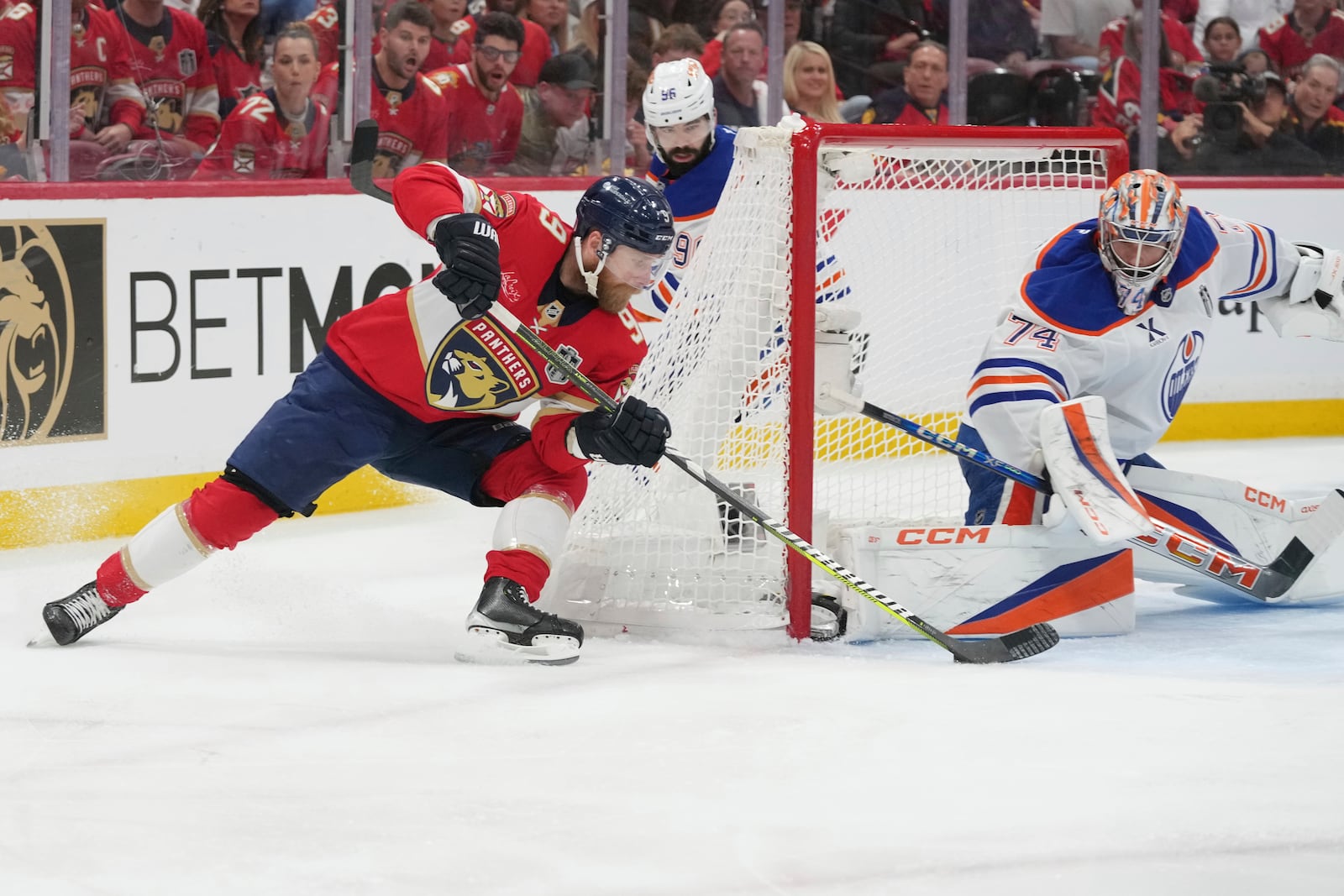 Edmonton Oilers goaltender Stuart Skinner (74) blocks a shot by Florida Panthers center Sam Bennett (9) during the second period of Game 6 of the NHL hockey Stanley Cup Final Tuesday, June 17, 2025, in Sunrise, Fla. (AP Photo/Lynne Sladky)