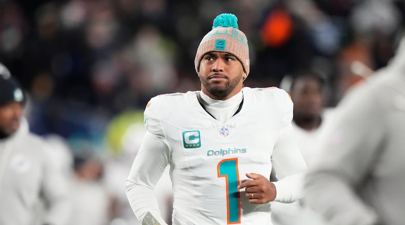 FILE - Miami Dolphins quarterback Tua Tagovailoa runs off the field during the first half of an NFL football game against the New England Patriots in Foxborough, Mass., Jan. 4, 2026. (AP Photo/Robert F. Bukaty, file)