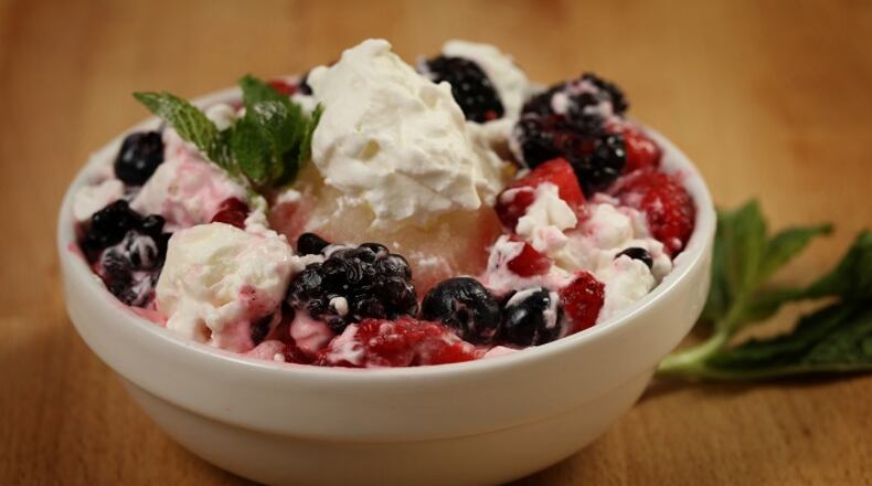 Eton mess, the summer treat mix of broken up meringue pieces and smashed berries stirred into sweetened whipped cream, gets a boost in this version with homemade lemon sorbet. (E. Jason Wambsgans/Chicago Tribune/TNS) Shannon Kinsella / food styling)