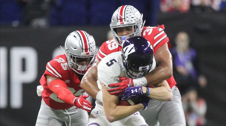 Ohio StateÃs Malik Harrison (39) and Brendon White (25) tackle NorthwesternÃs Isaiah Bowser, a Sidney High School graduate, in the Big Ten Championship on Saturday, Dec. 1, 2018, at Lucas Oil Stadium in Indianapolis. David Jablonski/Staff