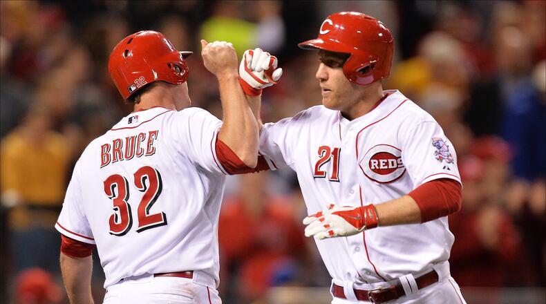 CINCINNATI, OH - MAY 1:  Todd Frazier #21 of the Cincinnati Reds is congratulated by teammate Jay Bruce #32 of the Cincinnati Reds after Frazier hit a two-run home run in the sixth inning against the Milwaukee Brewers at Great American Ball Park on May 1, 2014 in Cincinnati, Ohio. Cincinnati defeated Milwaukee 8-3.  (Photo by Jamie Sabau/Getty Images)