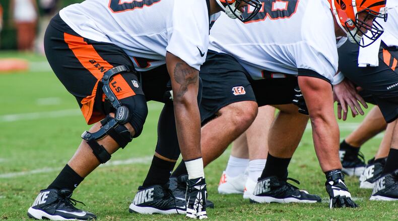 Offensive tackle Cedric Ogbuehi gets ready for the snap on the first day of the Cincinnati Bengals training camp on her birthday Friday, July 29 at their practice fields near Paul Brown Stadium in Cincinnati. NICK GRAHAM/STAFF