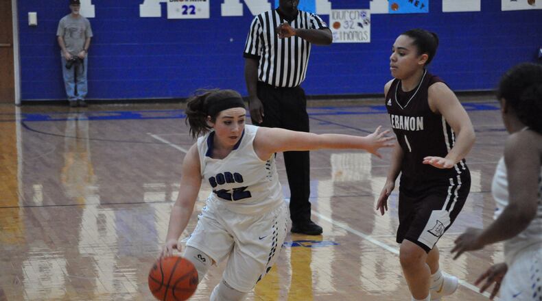 Springboro senior Lily Browning drives past Lebanon’s Alexis Straw during the Panthers 58-47 victory against the Warriors on Feb. 10, 2018. Nick Dudukovich/CONTRIBUTED