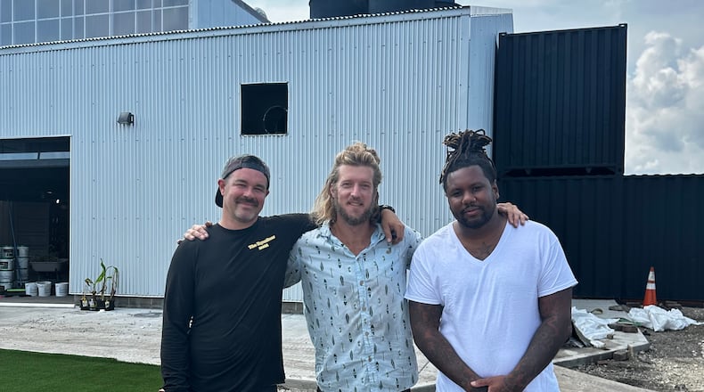 Chef Dane Shipp is opening a new concept at The Silos, a food hall and beer garden expected to open in the fall near 2nd Street Market in downtown Dayton. Pictured (left to right) are food hall owners Shannon Thomas and Wes Hartshorn with Chef Dane Shipp (CONTRIBUTED PHOTO).