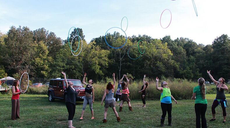 Lucy Tenhundfeld will share her love of hula hooping on March 7 at Haven Studio in Middletown. Shown is a similar event at Terrapin Hill Farm in Kentucky. CONTRIBUTED
