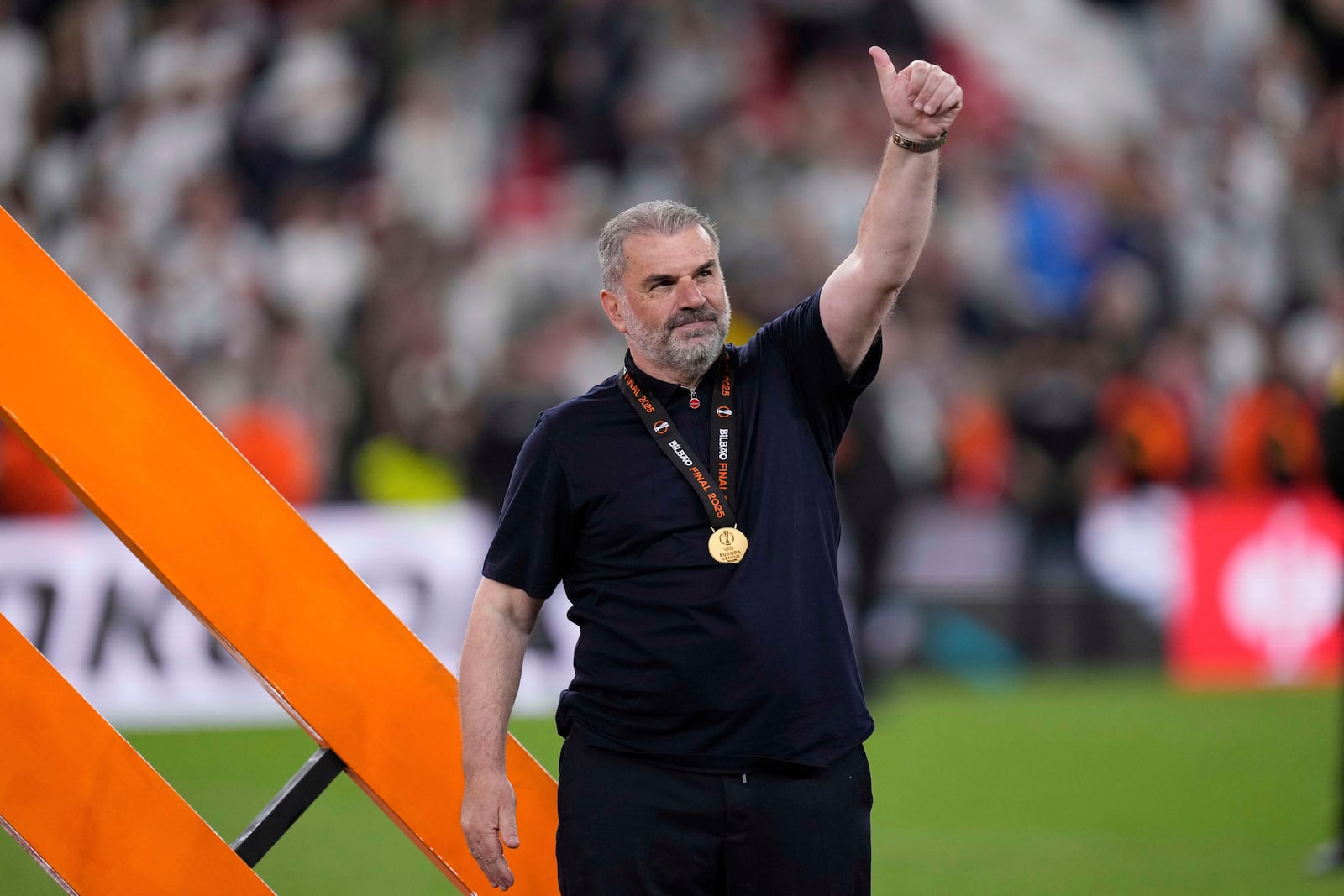 Tottenham's head coach Ange Postecoglou applauds fans at the end of the Europa League final soccer match between Tottenham Hotspur and Manchester United at the San Mames Stadium in Bilbao, Spain, Wednesday, May 21, 2025. (AP Photo/Bernat Armangue)