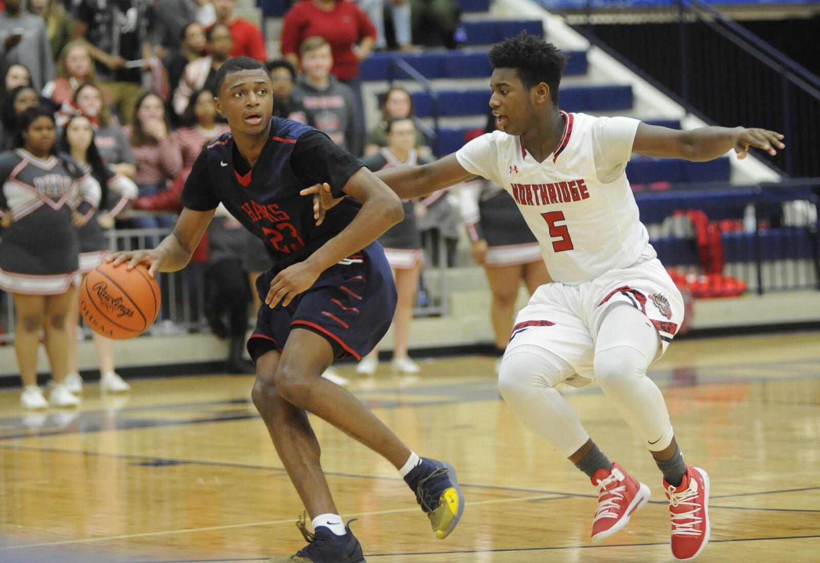 Northridge defender Denny Moses (right) checks Morgan Safford of Hartley. Northridge defeated Col. Hartley 60-56 in a boys high school basketball D-II regional semifinal at Trent Arena on Thursday, March 14, 2019. MARC PENDLETON / STAFF