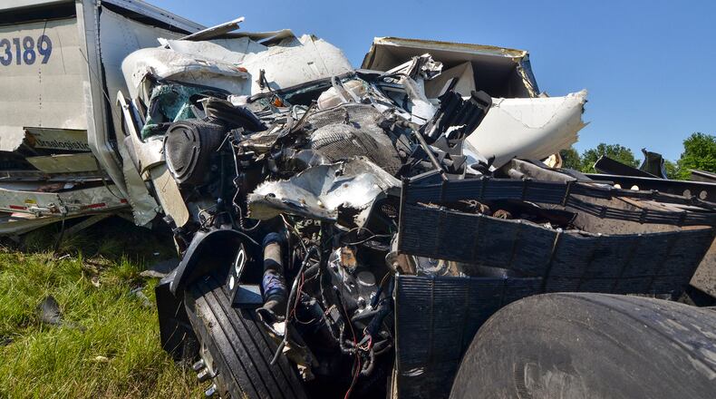 Debris after a deadly wreck is seen on westbound Interstate 70 near Terre Haute, Ind., Tuesday, July 18, 2017. (Austen Leake/The Tribune-Star via AP)