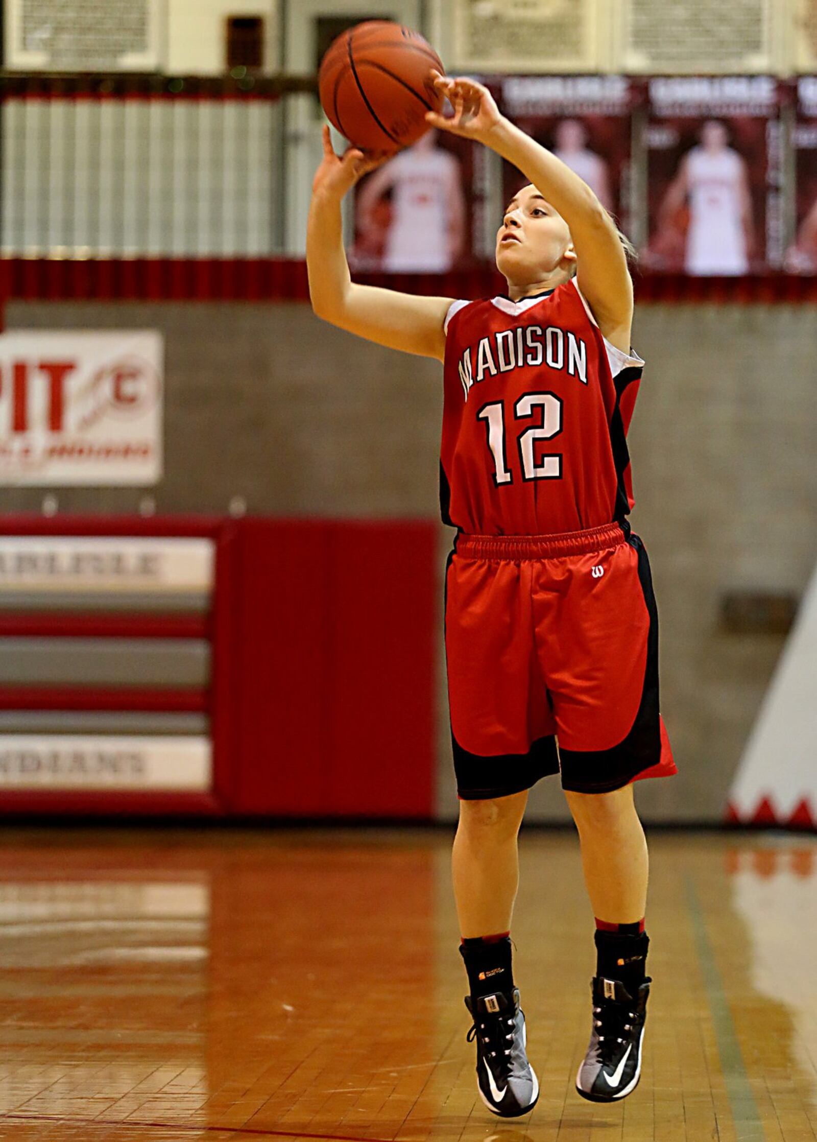 Madison’s Jackie Kovscek connects for one of her three 3-pointers during Saturday afternoon’s game at Carlisle. CONTRIBUTED PHOTO BY E.L. HUBBARD