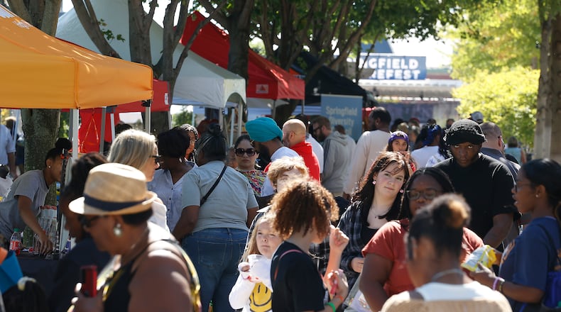 Springfield CultureFest 2023 brought thousands of visitors to the downtown area Saturday, Sept. 23, 2023. The annual festival, held in a new location on Main Street and National Road Commons park, includes merchandise and informational vendors, bands, dance groups, a DJ, food trucks, and the Cincinnati Circus group. BILL LACKEY/STAFF