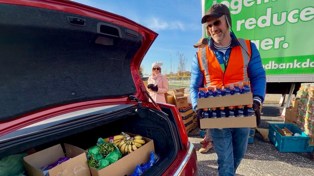 A Foodbank Inc. mobile pantry in Vandalia saw dozens of cars line up to receive produce, bread and other food items on Wednesday, Nov. 12, 2025. STAFF/DAVID SHERMAN
