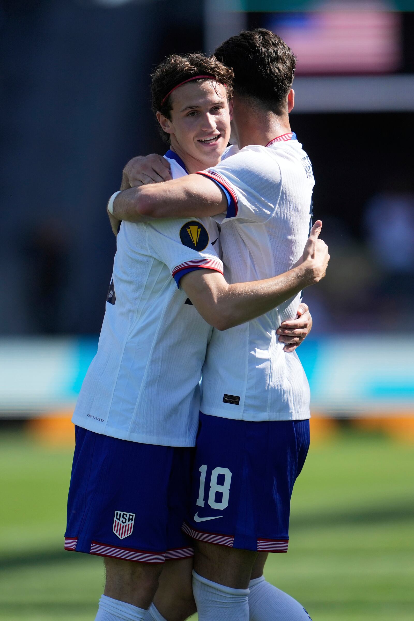 United States midfielder Brenden Aaronson, left, is congratulated by midfielder Paxten Aaronson after scoring against Trinidad and Tobago during the second half of a CONCACAF Gold Cup soccer match in San Jose, Calif., Sunday, June 15, 2025. (AP Photo/Jeff Chiu)