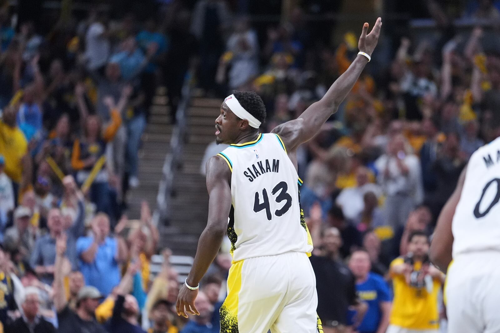 Indiana Pacers forward Pascal Siakam (43) celebrates after a basket against the Milwaukee Bucks during the second half of a first-round NBA basketball playoff game in Indianapolis, Tuesday, April 22, 2025. (AP Photo/Michael Conroy)