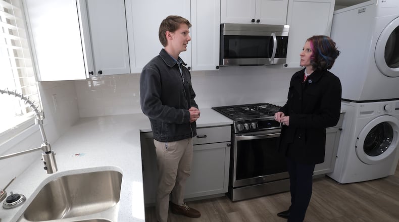 Andrew Good talks with his realtor, Tiffany Lobertini, in the kitchen of his new house in Kettering Wednesday, Jan. 29, 2025. Good is slated to close on the home this week. BILL LACKEY/STAFF