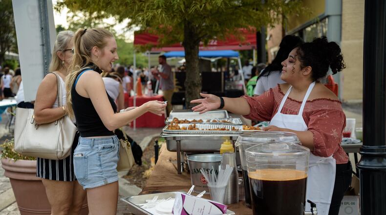 Sample your way through the Oregon District on Saturday, Sept. 17 from noon to 6 p.m. with the return of the Taste of the Oregon (File Photo). TOM GILLIAM / CONTRIBUTING PHOTOGRAPHER