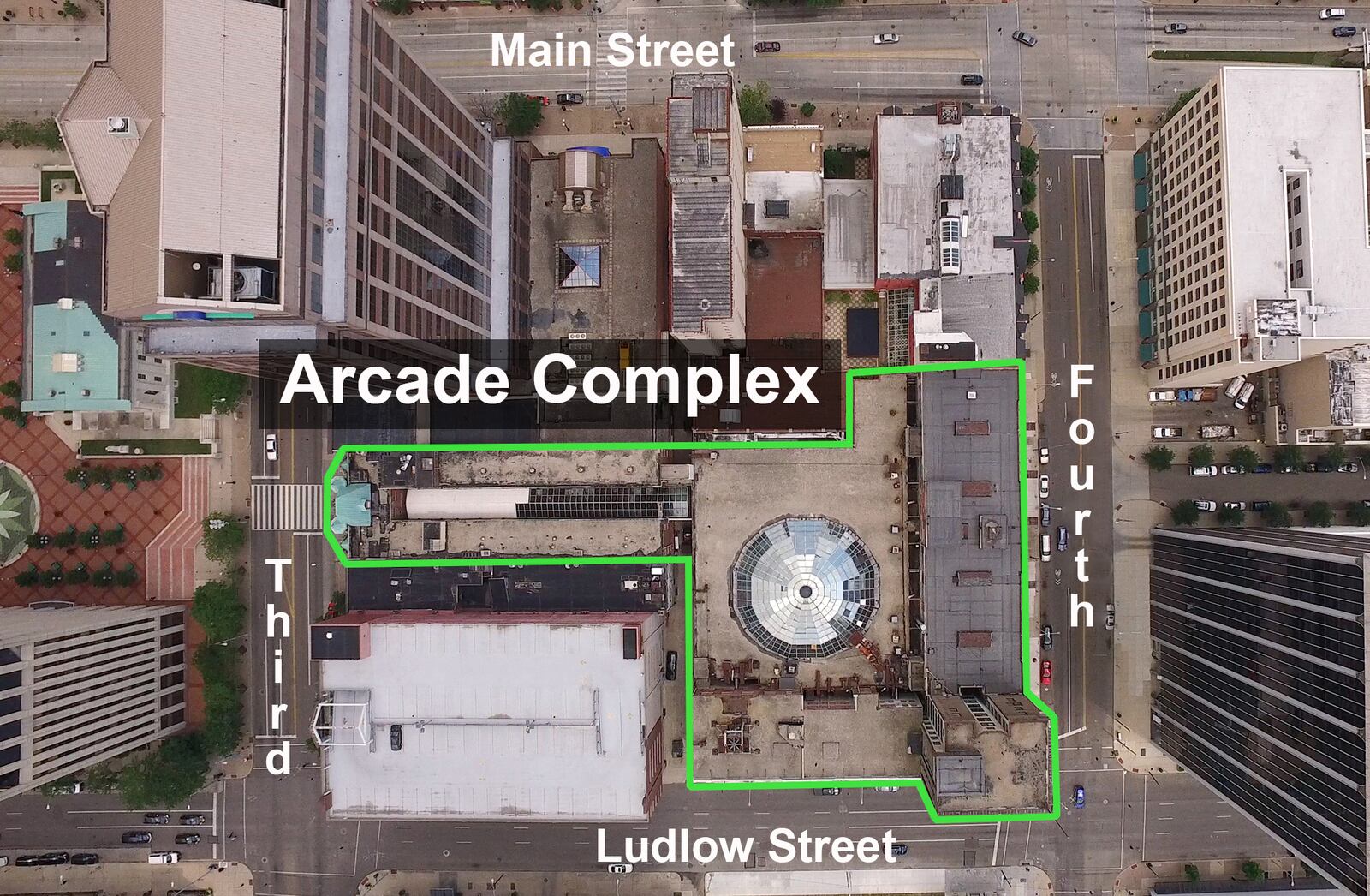 Straight down view of the Dayton Arcade complex.  Main Street is at the top, Ludlow at the bottom.  The Third Street Arcade entrance is at the left with the domed window over the Arcade Market area in the center.   TY GREENLEES / STAFF