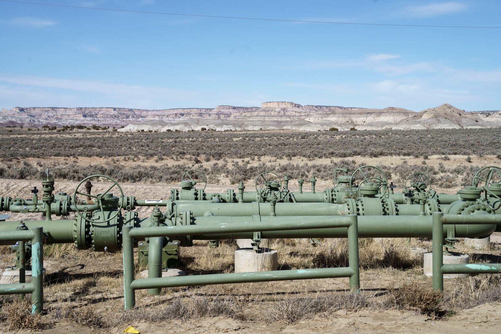 A view of natural gas pipes installed above ground in a field at a well pad in Counselor, N.M., Navajo Nation, on Tuesday March 11, 2025. (Nadav Soroker/Searchlight New Mexico via AP)
