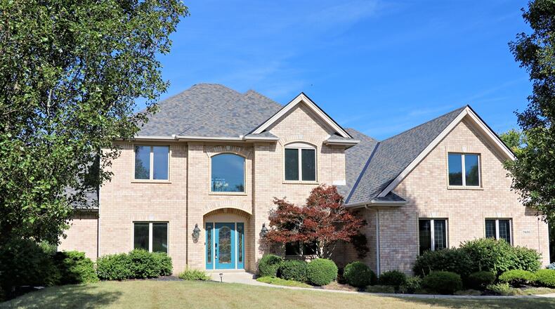 Listed for $850,000 by eXp Realty, the house at 7691 Deer Path Court in Clearcreek Twp. has about 4,314 square feet of living space. The 1.12-acre property includes a garden barn, a four-car garage and an in-ground swimming pool with slide and concrete patio deck. Part of the tree-lined back yard is surrounded by a metal fence and a concrete driveway leads up to the divided four-car garage with storage and workshop space. CONTRIBUTED