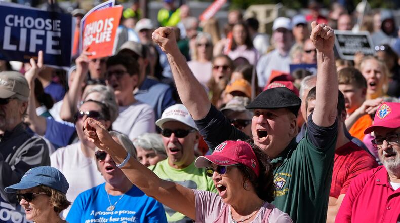 FILE - Demonstrators turn out for "Ohio March for Life" to support ending abortion access in Ohio at the Statehouse in Columbus, Ohio, Oct. 5, 2022. On Tuesday, Jan. 3, 2023, Ohio's attorney general asked the Ohio Supreme Court to weigh in on the future of the state's near-ban on abortions, despite arguing less than six months ago that the same court lacked jurisdiction to determine the paused law's constitutionality. (Barbara Perenic/The Columbus Dispatch via AP, File)