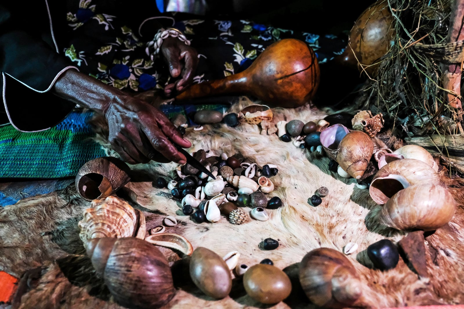 Traditional healer Rose Mukite displays animal shells inside her igloo-shaped shrine during an interview with The Associated Press in Kampala, Uganda Monday, June 23, 2025. (AP Photo/Hajarah Nalwadda)