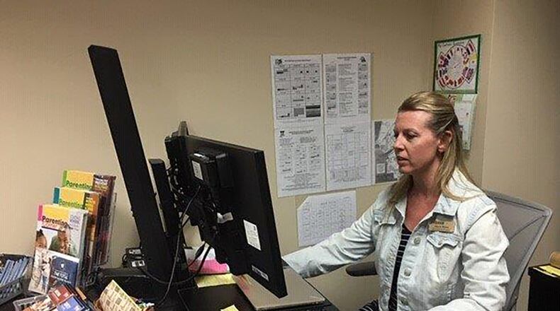 Janet Wynn, Wright-Patterson Air Force Base school liaison officer, works to provide information to families and students pertaining to STEM (science, technology, engineering and math) subjects, AFJROTC, creative teaching and social/emotional development and the Military Interstate Children’s compact Commission related to end of course exams. (U.S. Air Force photo/Kimberly Gaither)