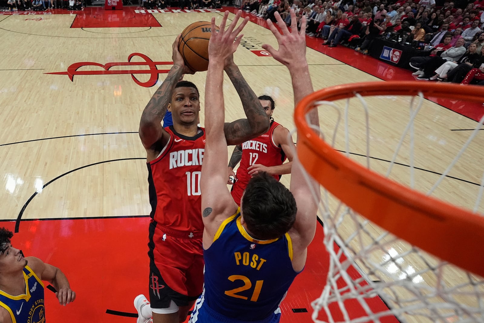 Houston Rockets forward Jabari Smith Jr. (10) shoots over Golden State Warriors center Quinten Post (21) during the second half of Game 5 of an NBA basketball first-round playoff series, Wednesday, April 30, 2025, in Houston. (AP Photo/David J. Phillip)