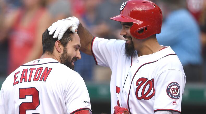 WASHINGTON, DC - AUGUST 14:  Adam Eaton #2 of the Washington Nationals celebrates a three home run with Anthony Rendon #6 in the fifth inning during a baseball game against the Cincinnati Reds at Nationals Park on August 14, 2019 in Washington, DC.  (Photo by Mitchell Layton/Getty Images)