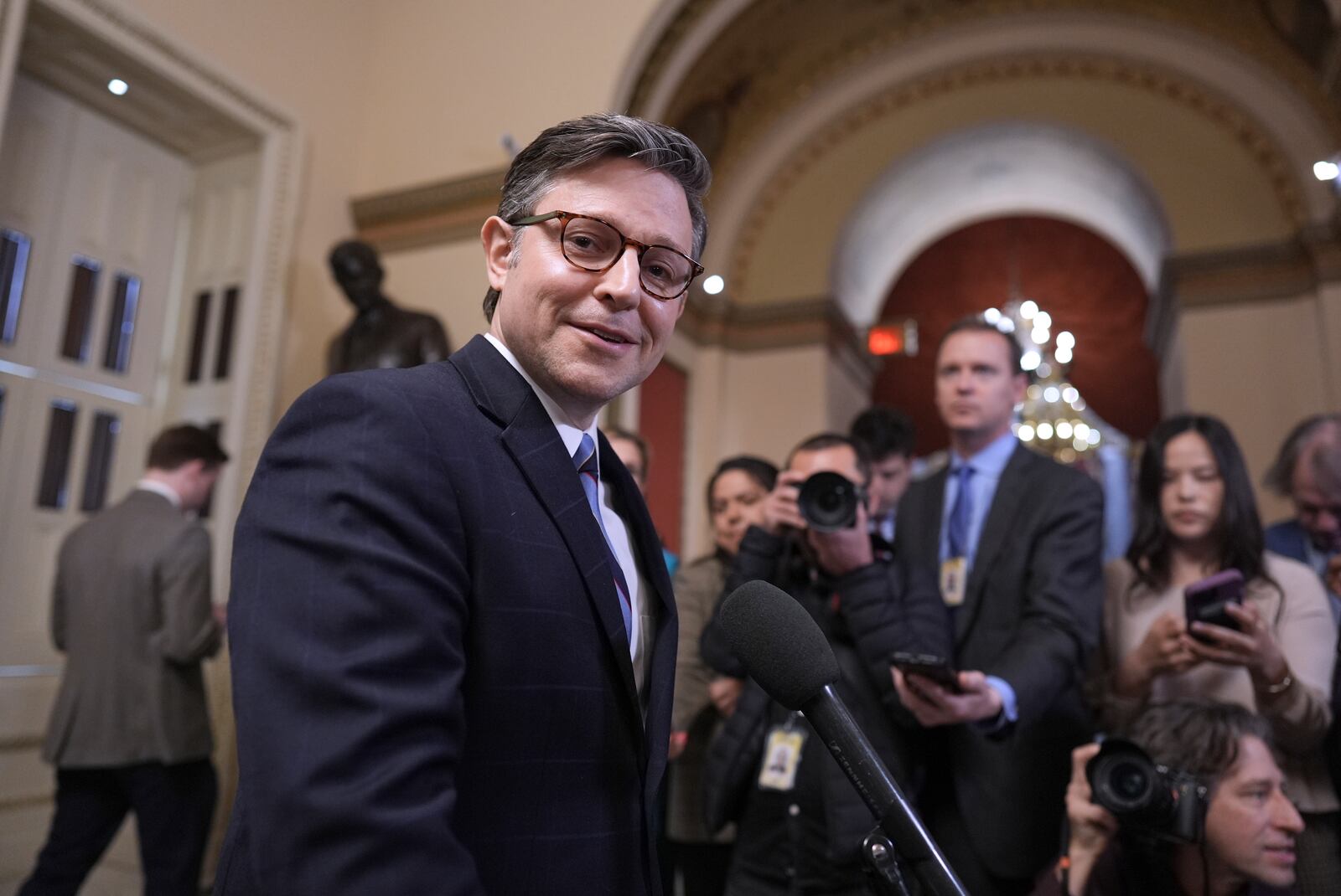 Speaker of the House Mike Johnson, R-La., talks to reporters just after House Republicans narrowly approved their budget framework, at the Capitol in Washington, Thursday, April 10, 2025. (AP Photo/J. Scott Applewhite)
