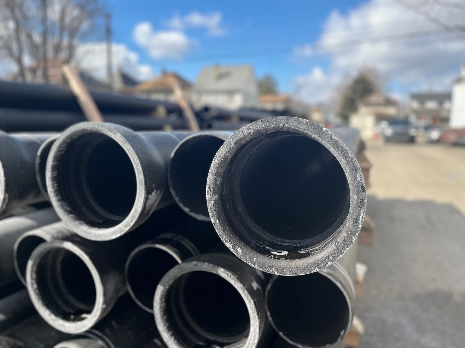 Water pipes stacked up on Bierce Avenue in East Dayton. CORNELIUS FROLIK / STAFF