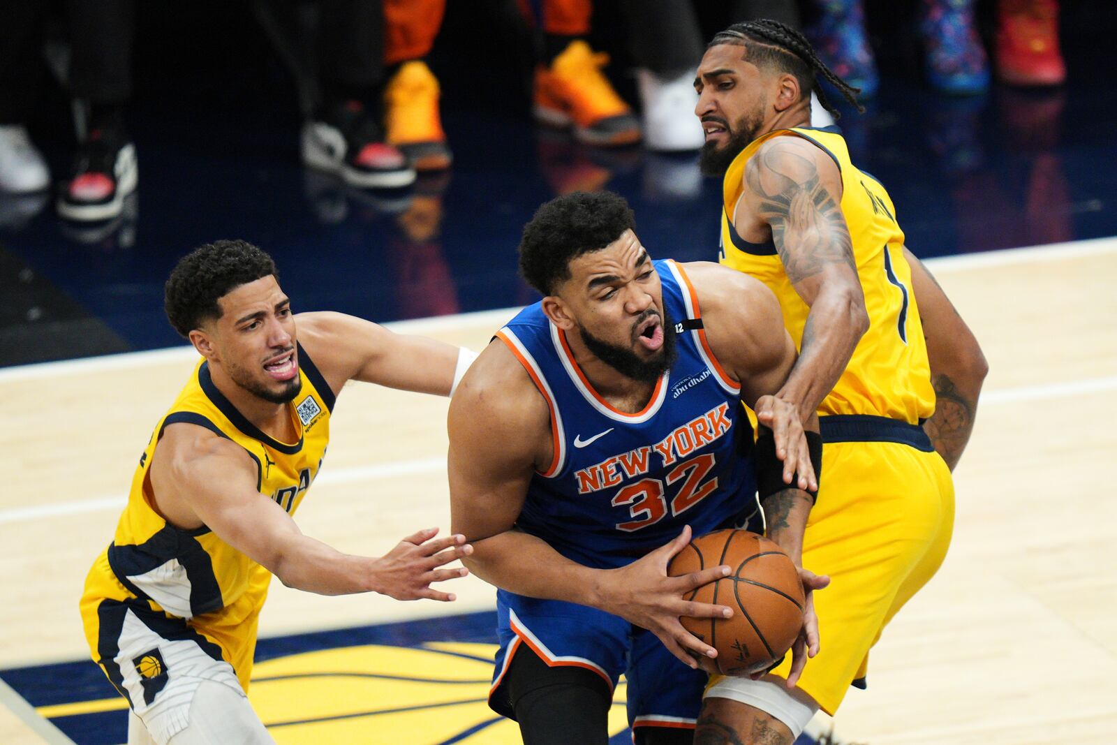 Indiana Pacers forward Obi Toppin (1) defends against New York Knicks center Karl-Anthony Towns (32) during the first half of Game 6 of the Eastern Conference finals of the NBA basketball playoffs in Indianapolis, Saturday, May 31, 2025. (AP Photo/AJ Mast)