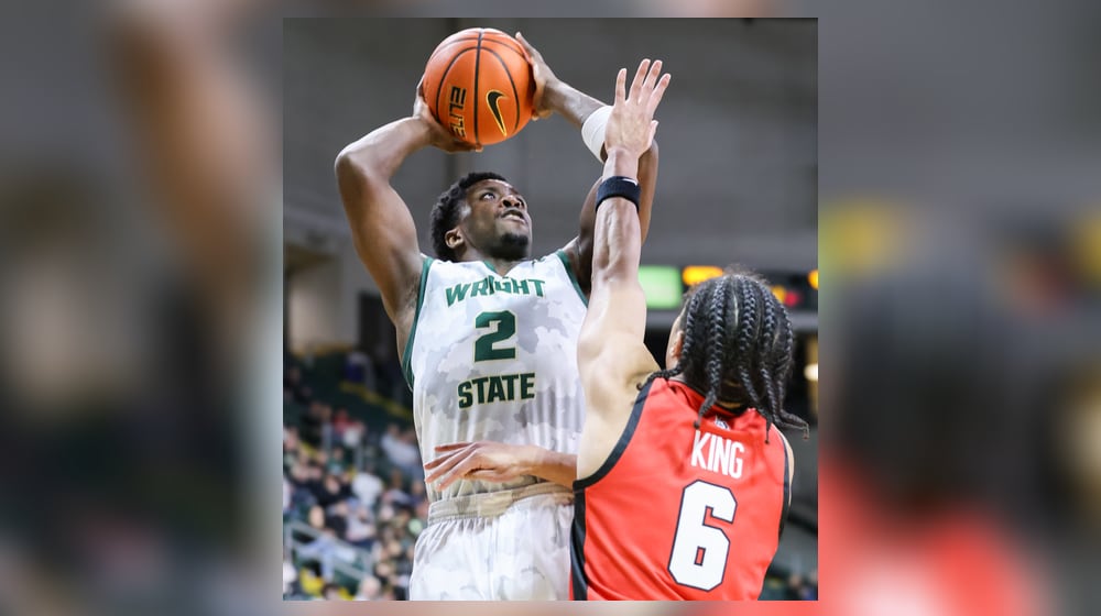 Wright State guard Sam Alamutu shoots with pressure from Youngstown State's Drew King during a Horizon League game on Thursday, Jan. 15 at Ervin J. Nutter Center in Fairborn. BRYANT BILLING/STAFF