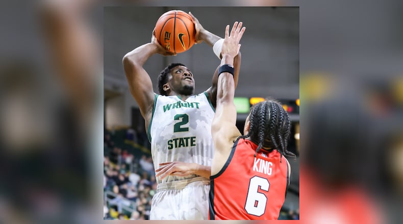 Wright State guard Sam Alamutu shoots with pressure from Youngstown State's Drew King during a Horizon League game on Thursday, Jan. 15 at Ervin J. Nutter Center in Fairborn. BRYANT BILLING/STAFF